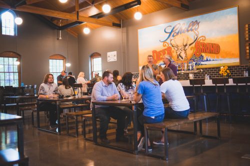 People sitting in the Schell's Brewery Bier Halle