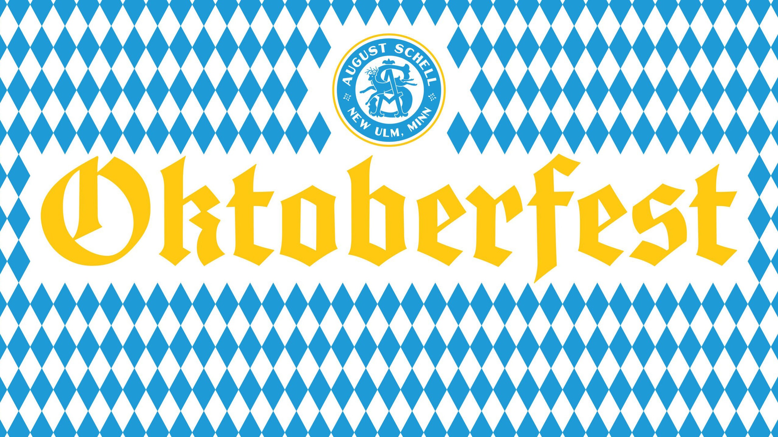 Yellow "Oktoberfest" text in an Old English-style font, centered on top of a diamond-checkered blue and white Bavarian style background. August Schell Brewing Company circular logo is above "Oktoberfest"